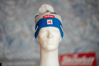 a white mannequin head with a red and white hat