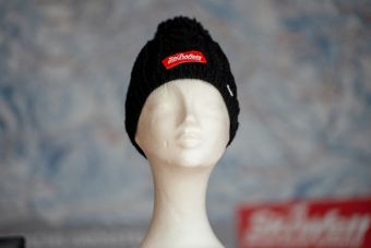 a black knit hat on a mannequin SKIWELT